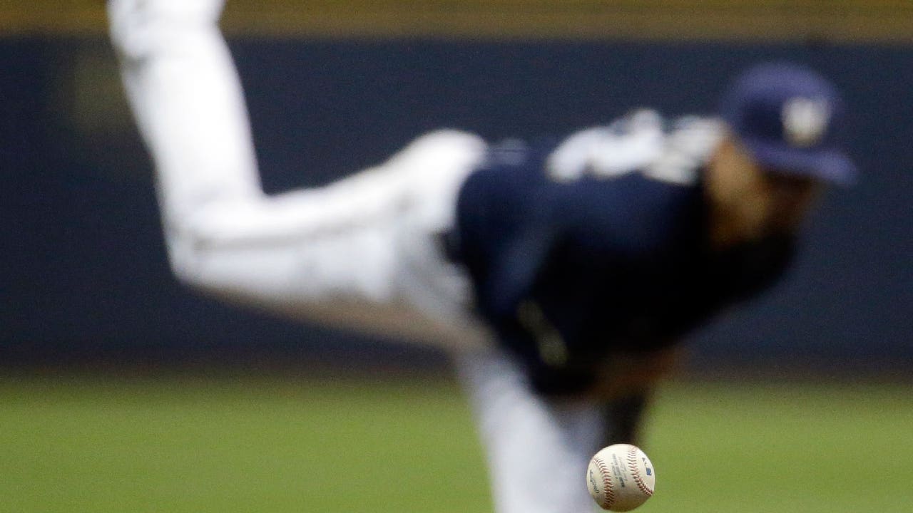 Brewers surge past Nationals late